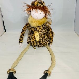 Shelf sitting figurine with fun accents.